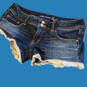 American Eagle blue jean shorts with white lace detail. Womens size 8
